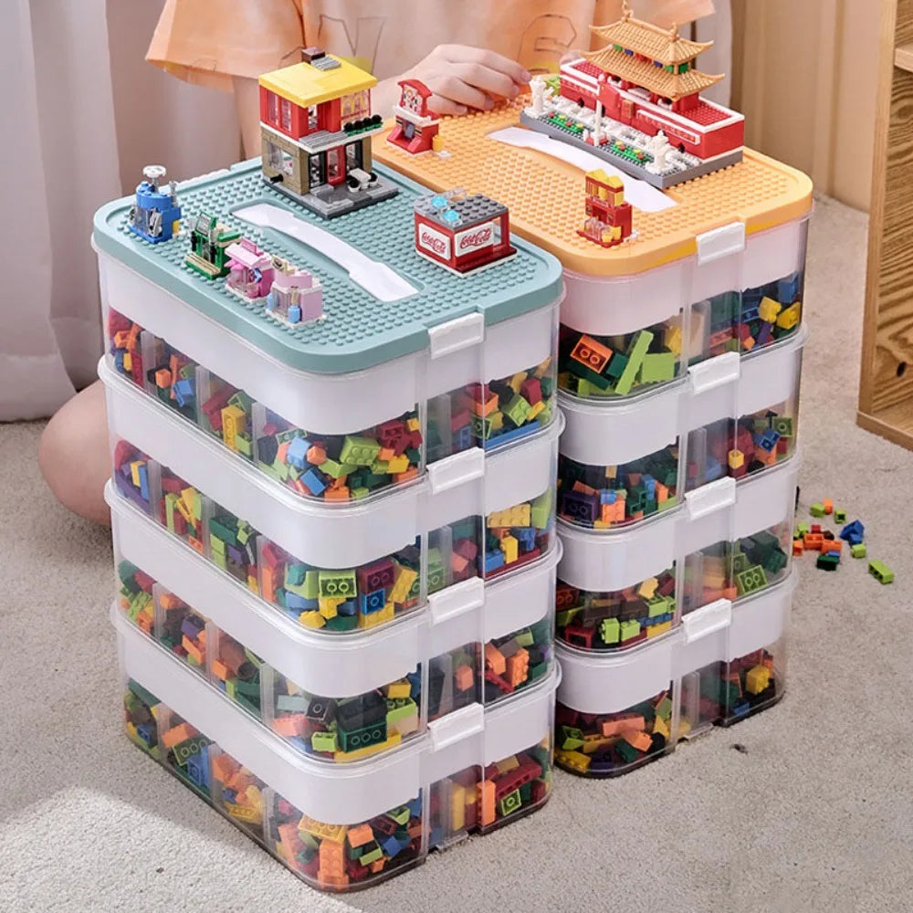 Stackable transparent Lego-compatible storage boxes with colorful building blocks and playable lids, ideal for toy organization and display